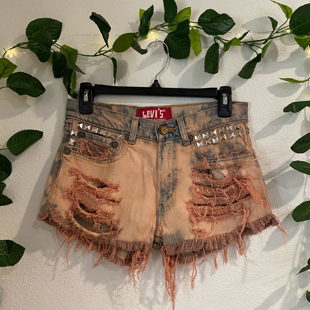 Custom dyed and shredded denim Levi’s shorts